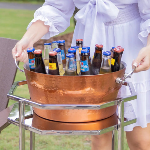 Woman carrying Insulated Rose Copper Double Wall Ice Bucket For Parties And Entertaining, Leak Proof Champagne And Wine Cooler With Sturdy Handles