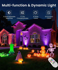 Colorful Halloween display using 8 Pack RGBW Low Voltage Landscape Lights Kit with 100W Transformer, remote control visible.