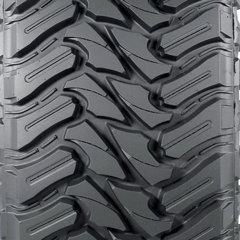 Close-up tread pattern of Trail Blade MT Mud Terrain Tire LT285/75R16 E for Jeeps and light trucks with rugged wraparound lugs.