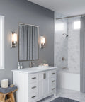 Modern bathroom with One Hole Single Handle Bathroom Sink Faucet In Brushed Nickel With Push And Seal Drain, on white vanity