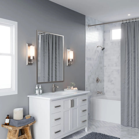 Modern bathroom with One Hole Single Handle Bathroom Sink Faucet In Brushed Nickel With Push And Seal Drain, on white vanity
