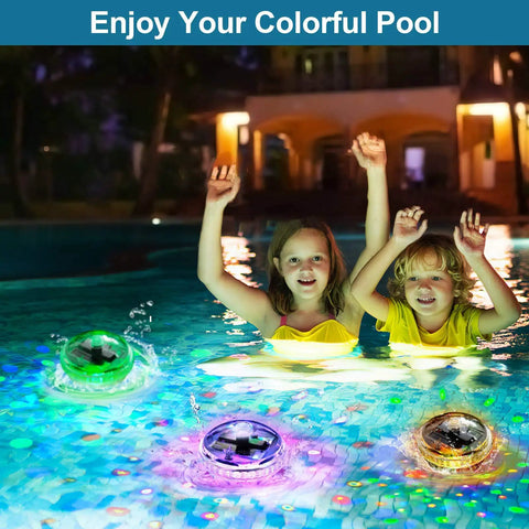 Two children in a pool with glowing solar lights, showcasing Solar Pathway Lights Outdoor 4 Pack With Auto Color Changing Waterproof Super Bright LED Path Lights For Yard Driveway Walkway Landscape Party Decor Christmas Decoration.