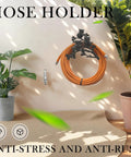 Owl Cast Iron Hose Holder For Wall Mount, Heavy Duty Garden Hose Hanger With Vintage Style, mounted on outdoor wall with plants