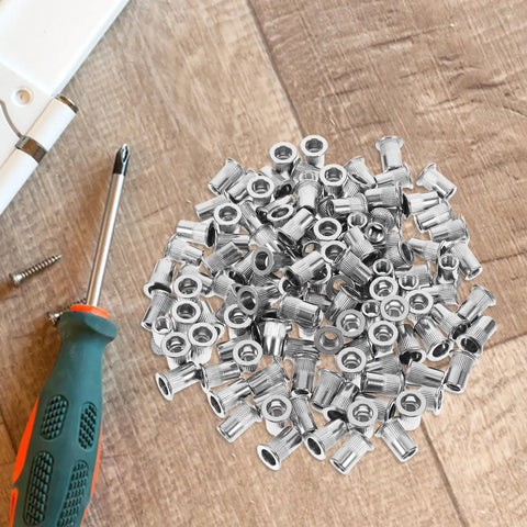 Stainless Steel Rivet Nuts Kit With 120 Pieces Flat Head Knurled Threaded Inserts for quick connections on wooden surface