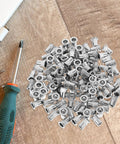 Stainless Steel Flat Head Knurled Rivet Nuts Kit 1/4-20 Thread Rivet Nut Inserts, 120 Pcs scattered on wooden surface