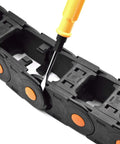 Open Type Drag Chain Cable Carrier With End Connectors R75 35x50mm, L1000mm Length being adjusted with a tool
