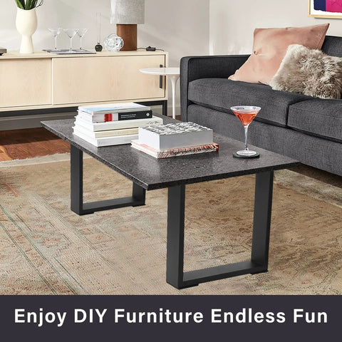 Living room with table using Beefy 16 Inch DIY Modern Square Coffee Table Legs Set, black glossy, supporting books and drink.
