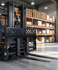 Rock Solid Hydraulic Adjustable Sliding Forks Designed For Your Skid Steer Loader in warehouse setting with pallets.