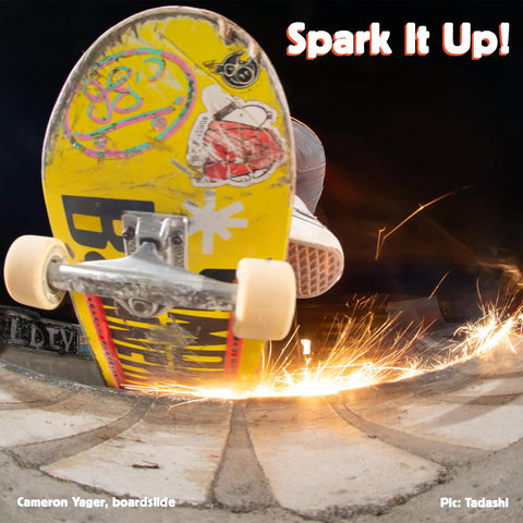 Skateboard with Sparking Skateboard Rails With Infused Flint Cylinders creating sparks during boardslide.