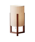 Quinn Table Lantern with walnut birch wood crisscross base and natural linen shade, space-saving design, modern vintage blend.