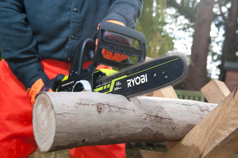 Hella Smooth 18V Brushless Battery Chainsaw With 30Cm Oregon Bar cutting through a log with tool-less tensioning in action.