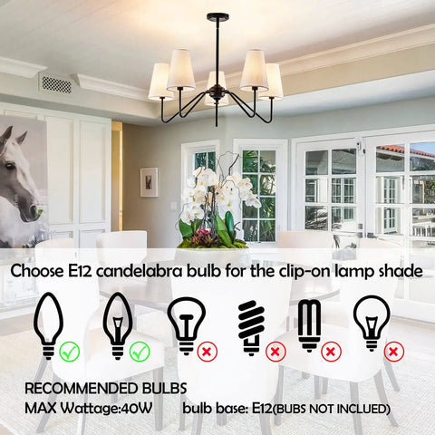 Totally Chic Modern Farmhouse Small Chandelier In Black Finish over dining table with white chairs and large windows