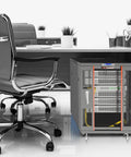 Solid Floor Standing Server Rack Cabinet With Secure Locking Doors For Heavy Network Gear And Router Hardware Straight Up Engineered For Reliable Storage In 12U And 18U Black Finish placed next to an office chair.