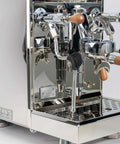 Pro Grade Dual Boiler Espresso Maker With PID Precision Tuning Hardened Stainless Frame And Smooth Heat Exchange Tech with a polished chrome finish.