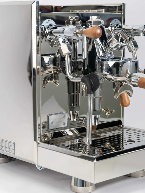 Pro Grade Dual Boiler Espresso Maker With PID Precision Tuning Hardened Stainless Frame And Smooth Heat Exchange Tech with a polished chrome finish.