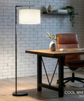Modern LED Floor Lamp With Tan Fabric Shade Tall Corner Pole Standing Light For Living Rooms And Offices Ideal Bedroom Reading Light Black Finish That Fits Contemporary Home Decor And Brings A Bright Warm Vibe To Any Space in home office setting, displaying cool white illumination.