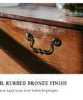 Oil Rubbed Bronze Drop Bail Drawer Pull 4 Pack on wooden dresser 4 inch center to center colonial style with traditional bead center
