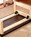 Badass Heavy Duty Folding Brackets For Tables And Bed Legs, 8 Pack Self Locking Hinges With Wood Screws, Sturdy Cold Rolled Steel Extension Supports For Workbenches, Black on a wooden table.