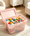 Sick Space Saver Pink Plastic Storage Bin Knocking Clutter Out With 18 Gallon filled with colorful building toys in a living room.