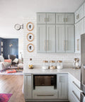 Modern kitchen with Beefy Solid Core Cabinet Pulls With 18 Inch Center Elusive Golden Nickel Finish on light gray cabinets.