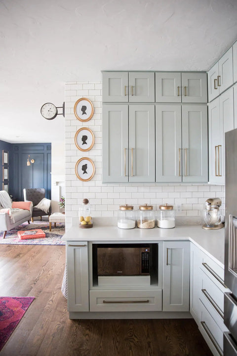 Modern kitchen with Beefy Solid Core Cabinet Pulls With 18 Inch Center Elusive Golden Nickel Finish on light gray cabinets.