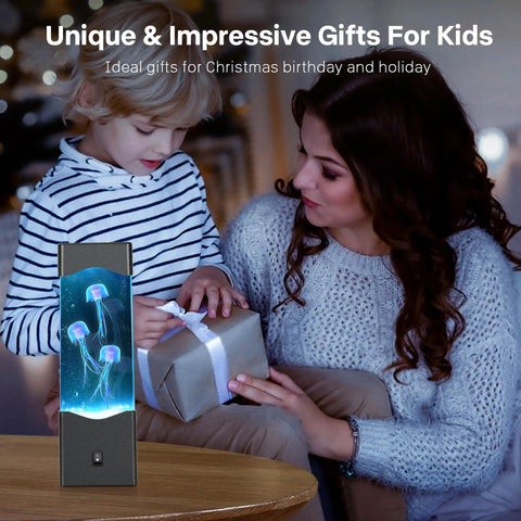 Child opening gift with Jellyfish Lamp Mood Night Light For Desk And Room Decor, USB Powered Aquarium Light in background.