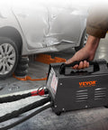 Spot Weld Dent Puller Kit With Two Weld Guns next to a dented car for auto body dent repair with 3KW stud welder and manual weld option