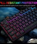 Dope Full Size Gaming Keyboard With Quick Turn Volume Knob, 104 Keys Wired PC Peripheral Featuring Fresh RGB Lighting And Crisp Feedback For Weekend Warriors on rocky surface with water droplets.
