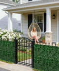 Artificial Ivy Privacy Fence Screen 120 By 40 Inches Ultra Dense 1200 Leaf Faux Ivy Panels installed in front of a house porch