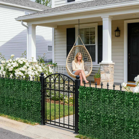 Artificial Ivy Privacy Fence Screen 120 By 40 Inches Ultra Dense 1200 Leaf Faux Ivy Panels installed in front of a house porch