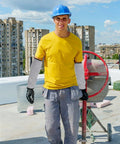 Heavy Duty Cut Resistant Arm Sleeves With Scratch Proof Armor For Gardening And Butchery Tasks Bite Resistant Guards worn by a construction worker.