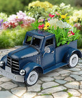 Farmhouse Blue Truck Tabletop Decor For Indoor And Outdoor Use Vintage Car Truck Decorations with flowers in truck bed.