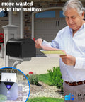 Man checking mail with Wireless Mailbox Notification System With Audible Beep And Visual Light, 350 To 450 Feet Range