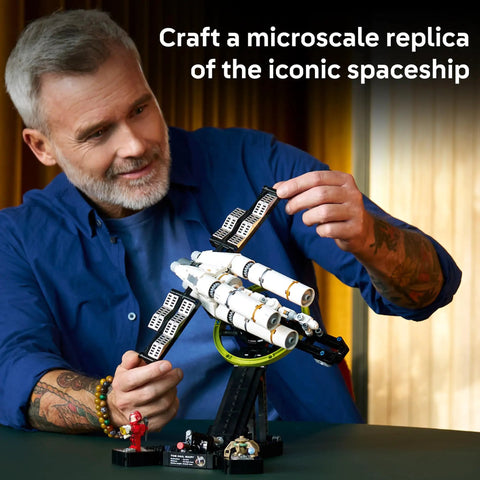 Man assembling Project Hail Mary Microscale Spacecraft Model Collectible Set For Adults, Ages 14 Plus, on gravity simulation stand.