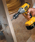 Impact Driver Drill Chuck With One Quarter Inch Quick Connect, all-metal build, in use for wood drilling, one-handed operation.