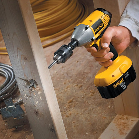 Impact Driver Drill Chuck With One Quarter Inch Quick Connect, all-metal build, in use for wood drilling, one-handed operation.