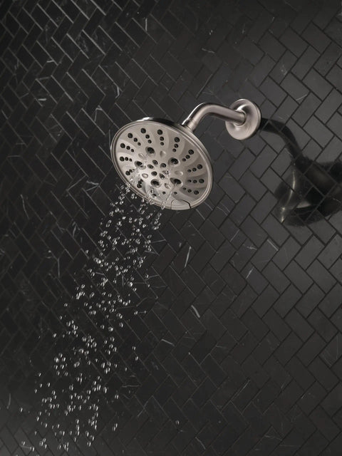H2Okinetic Rain Shower Head With Five Settings In Stainless Finish Touch Clean Nozzle System spraying water in bathroom