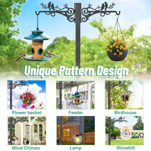 Outdoor decorative metal post with two arms for hanging feeders, baskets, wind chimes, and a lamp in garden setting.