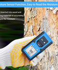 Stud Finder Wall Scanner, 4 in 1 Detector for Wood Metal AC Wire measuring moisture on tree bark with gloved hand.