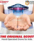 Person holding a blue Hand Operated Scoot Drone For Kids And Adults With Hands Free Motion Sensor LED Indoor UFO Toy