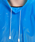 Close-up of blue reusable rain poncho with drawstring hood, part of Two Pack Reusable Rain Ponchos For Adults With Drawstring Hood.