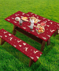 Christmas Reindeer Fitted Picnic Table and Bench Cover Set with reindeer pattern on a table in a grassy backyard.