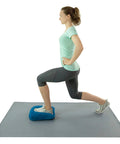 Teeter Core Restore Inflatable Lumbar Support Cushion For Back Pain Relief And Posture Correction used during a lunge exercise on a mat.