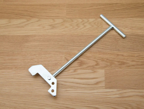 Universal Garbage Disposal Unjamming Wrench For Quick Jam Release Fits Waste King And Moen Disposals on wooden surface