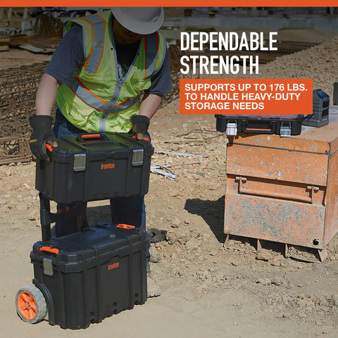 Man using Workhorse Light Duty Modular Rolling Toolbox System With Telescopic Handle And Mobile Base With Two Rugged Rubber Wheels Top Toolbox With Ten Removable Bins Mid Compartment With Lift Out Tray 176 Pound Weight Capacity on construction site.