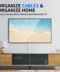 One Cord Cable Hider Kit showing paintable cable raceway under wall mounted TV above wooden console.