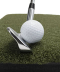 Close-up of club hitting ball on Heavy Duty Golf Practice Mat 10x30 Inch Hitting Strip for Indoor Outdoor Use Accepts Real Tees