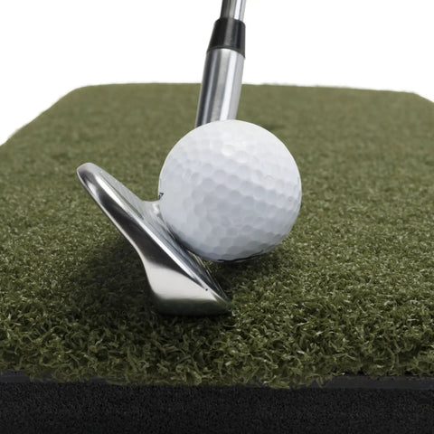 Close-up of club hitting ball on Heavy Duty Golf Practice Mat 10x30 Inch Hitting Strip for Indoor Outdoor Use Accepts Real Tees