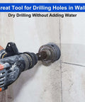 Orange cordless drill with a dry-core hole saw drilling into a concrete wall.