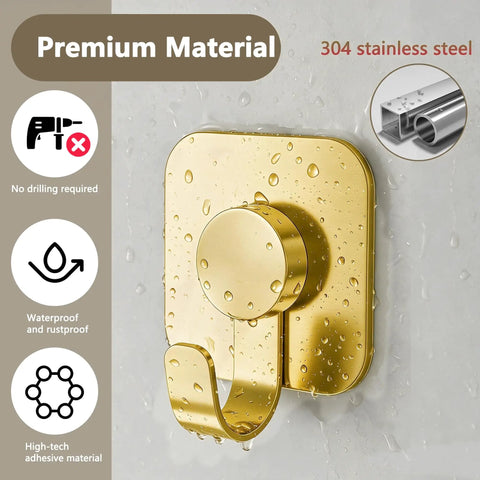 Heavy Duty Adhesive Wall Hooks In A Dope Four Pack, Stainless Steel Stick On Hangers With Badass Grip For Bathrooms And Kitchens, Waterproof And Super Fast To Put Up On Any Wall Or Door Without Drilling, Classic Gold Finish, close-up of gold hook on wet wall.